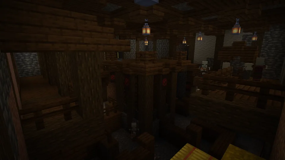 A torch-lit underground illager hideout full of enemies