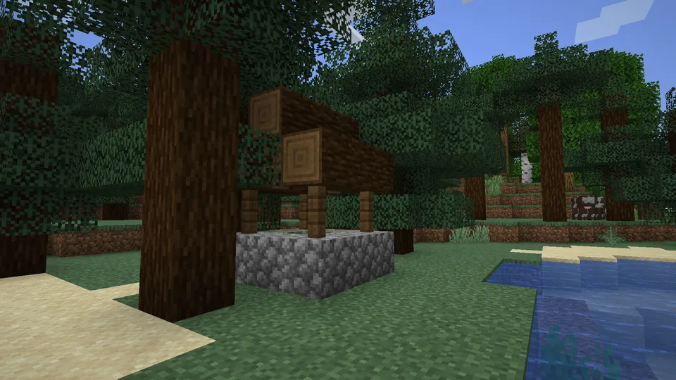 A small stone well standing in a grassy Minecraft biome